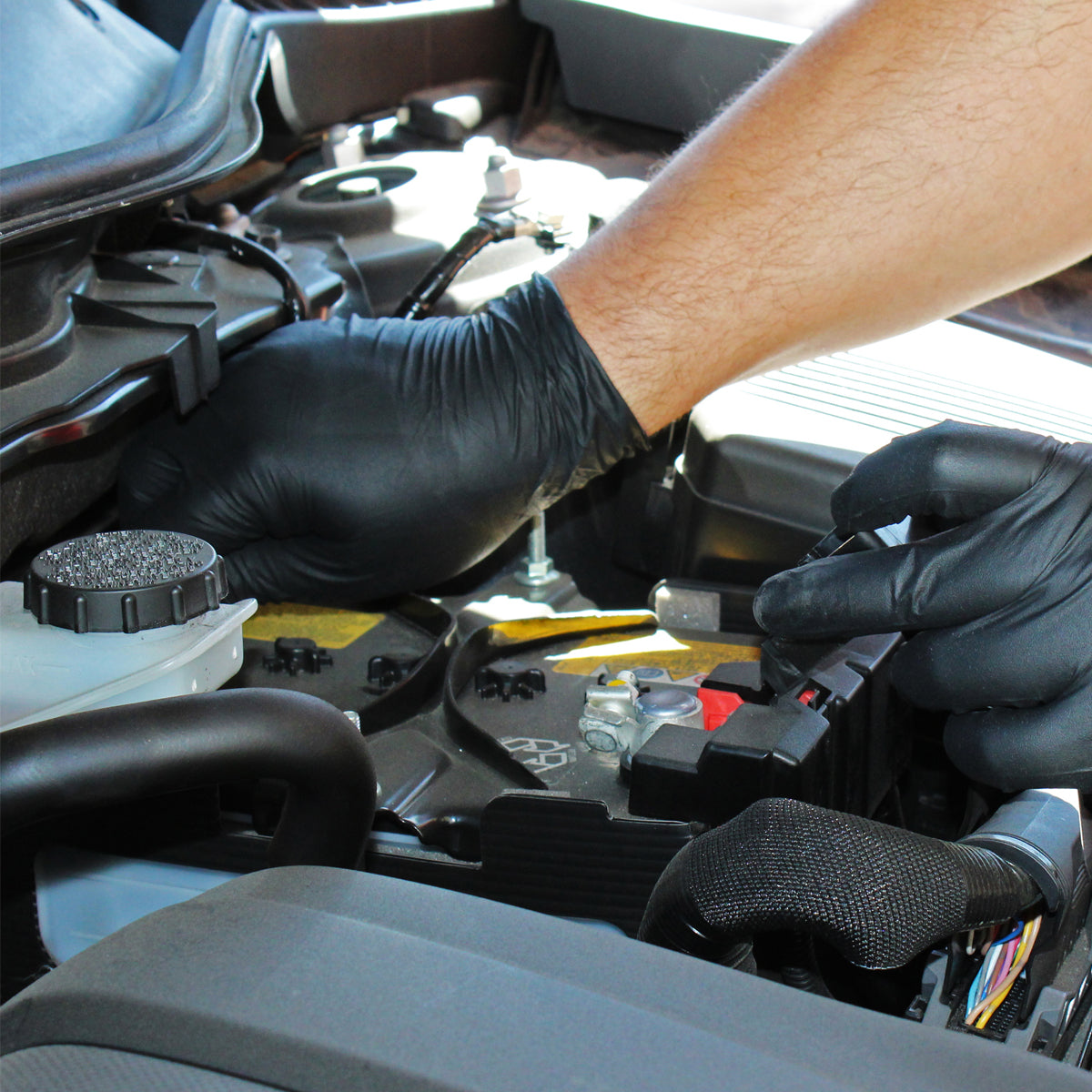 Mechanic using black nitrile gloves